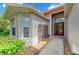 Close up of the home's attractive front entrance, featuring a decorative door and artistic metal ornamentation at 8906 Stone Harbour Loop, Bradenton, FL 34212