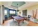 Spacious game room featuring a pool table, fireplace, and stylish decor at 8906 Stone Harbour Loop, Bradenton, FL 34212