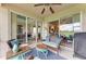 Inviting screened lanai with comfortable seating and a view of the game room at 8906 Stone Harbour Loop, Bradenton, FL 34212