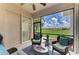Inviting screened lanai with comfortable seating and a scenic view of the lush lawn at 8906 Stone Harbour Loop, Bradenton, FL 34212