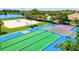 Aerial view of community recreation area with shuffleboard, bocce ball, pool, and volleyball at 8906 Stone Harbour Loop, Bradenton, FL 34212