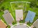 Aerial view of a well-maintained property featuring a landscaped yard and a fenced backyard at 8937 Excelsior Loop, Venice, FL 34293