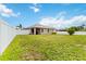 Spacious backyard featuring a white vinyl fence and a covered lanai for outdoor enjoyment at 8937 Excelsior Loop, Venice, FL 34293