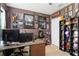 Unique bedroom featuring an eclectic collection of movie memorabilia and decor, complete with a desk and shelving at 8937 Excelsior Loop, Venice, FL 34293