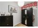 A walk-in closet with a black dresser, wardrobe, and decorative accents at 8937 Excelsior Loop, Venice, FL 34293