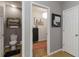 Hallway view leading into the home's water closet and walk-in closet at 8937 Excelsior Loop, Venice, FL 34293