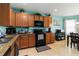 Spacious kitchen features stainless appliances, granite counters and ample cabinet space at 8937 Excelsior Loop, Venice, FL 34293