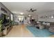 Inviting living room featuring a comfortable sofa, open bar, and stylish decor at 8937 Excelsior Loop, Venice, FL 34293