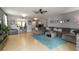 Spacious living room with breakfast bar, stylish sofa, and decorative accents at 8937 Excelsior Loop, Venice, FL 34293