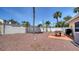 Gravel backyard with a patio set, grill, and privacy fence at 1116 S Moonmist Ct # M12, Sarasota, FL 34242