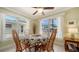 Bright dining area with decorative tablecloth and natural lighting at 1116 S Moonmist Ct # M12, Sarasota, FL 34242