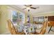 Dining Area with a view of the front yard and blue front door at 1116 S Moonmist Ct # M12, Sarasota, FL 34242