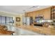 Kitchen with granite counters, maple cabinets and breakfast bar at 1116 S Moonmist Ct # M12, Sarasota, FL 34242