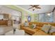 Comfortable living room with an open floor plan, archways, and a large leather sofa with decorative pillows at 1116 S Moonmist Ct # M12, Sarasota, FL 34242