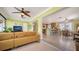 Open concept living room with seating, dining area, and kitchen in a bright and airy layout at 1116 S Moonmist Ct # M12, Sarasota, FL 34242