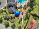 Aerial view of community amenities including pool, playground, and landscaped common areas at 11324 77Th E St, Parrish, FL 34219
