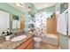 Stylish bathroom with modern fixtures, granite vanity and a tiled shower/tub combo at 11324 77Th E St, Parrish, FL 34219