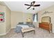 Comfortable bedroom with plush carpet, ceiling fan and neutral color scheme at 11324 77Th E St, Parrish, FL 34219
