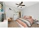 Comfortable bedroom with plush carpet, ceiling fan and a queen bed at 11324 77Th E St, Parrish, FL 34219