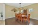 Dining room with hardwood floors and a decorative tree wall hanging at 11324 77Th E St, Parrish, FL 34219