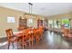 Elegant dining room featuring hardwood floors and a stylish light fixture at 11324 77Th E St, Parrish, FL 34219