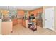 Spacious kitchen featuring stainless steel appliances, granite countertops, and wooden cabinets at 11324 77Th E St, Parrish, FL 34219