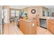 Open kitchen with an island, granite countertops, stainless steel appliances and breakfast nook at 11324 77Th E St, Parrish, FL 34219