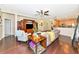 Comfortable living room with hardwood flooring and open-concept layout to kitchen at 11324 77Th E St, Parrish, FL 34219