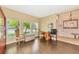 Bright and airy living room with beautiful hardwood flooring and large windows at 11324 77Th E St, Parrish, FL 34219