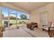 Screened in porch with outdoor seating, concrete flooring, and views of the backyard at 11324 77Th E St, Parrish, FL 34219