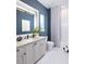 Bathroom featuring a vanity with stone countertops and stylish modern finishes at 1162 Blue Shell Loop, Sarasota, FL 34240