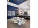 Dining room and kitchen with modern décor and stylish lighting at 1162 Blue Shell Loop, Sarasota, FL 34240