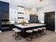 Spacious kitchen with a large island, black and white cabinetry, and modern pendant lighting at 1162 Blue Shell Loop, Sarasota, FL 34240