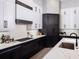 Elegant kitchen with custom cabinets, stainless steel appliances, and a large countertop at 1162 Blue Shell Loop, Sarasota, FL 34240