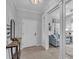 Welcoming foyer with tiled floor, stylish decor and view of the living room at 1301 Backspin Dr, Englewood, FL 34223