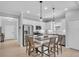 Modern kitchen with stainless steel appliances, granite countertops, and a central island with seating at 1301 Backspin Dr, Englewood, FL 34223