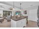 Open-concept kitchen island with granite countertop flowing into the living room at 1301 Backspin Dr, Englewood, FL 34223