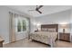 Comfortable bedroom with a ceiling fan, window and matching nightstands at 1301 Backspin Dr, Englewood, FL 34223