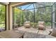 Inviting patio with comfortable seating and picturesque views of the surrounding greenery at 1301 Backspin Dr, Englewood, FL 34223
