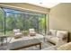 Relaxing screened-in patio with ample seating and peaceful backyard views at 1301 Backspin Dr, Englewood, FL 34223