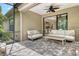 Outdoor patio featuring comfortable seating, stone flooring, and tranquil surroundings at 1301 Backspin Dr, Englewood, FL 34223