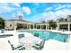 Gorgeous community pool featuring a hot tub, plenty of seating, and inviting lounge areas at 1301 Backspin Dr, Englewood, FL 34223