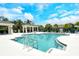 Stunning community pool area featuring poolside gazebos, lounge chairs, and clear blue water at 1301 Backspin Dr, Englewood, FL 34223
