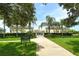 Picturesque recreation center with well-maintained grounds, mature trees, and a charming pathway for residents to enjoy at 1301 Backspin Dr, Englewood, FL 34223