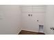 The utility room has wood-look vinyl flooring and washer/dryer hookups, plus a shelf for storage at 13125 Bayberry Way, Parrish, FL 34219