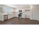 Well-lit kitchen featuring stainless steel appliances, white cabinets, and modern finishes at 13129 Bayberry Way, Parrish, FL 34219
