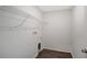 A laundry room with wood-look vinyl flooring, a wire shelf, and washer/dryer hookups at 13129 Bayberry Way, Parrish, FL 34219
