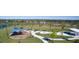 Aerial view of a community playground featuring a shaded play structure, picnic tables, and a landscaped park area at 13133 Bayberry Way, Parrish, FL 34219