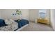 Bedroom featuring a blue comforter, decorative stickers on the wall, a window, and a small yellow cabinet at 13133 Bayberry Way, Parrish, FL 34219