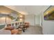 Comfortable bonus room with soft lighting, carpeted flooring, and modern decor at 13133 Bayberry Way, Parrish, FL 34219